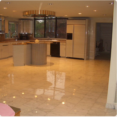 A White Color Tiled Floor in a Kitchen Space