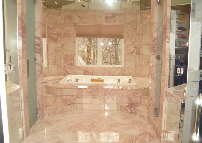 A Coral Color Tiles Bathroom Space With a Tub